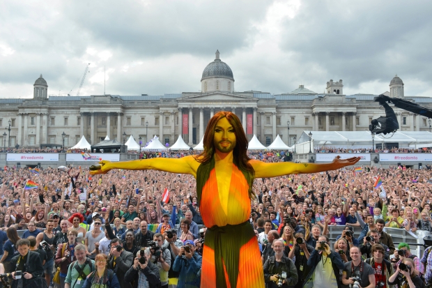 Pictured: Conchita Wurst on stage in Trafalgar Square. Conchita was introduced on staged by Sir Ian McKellen. More than 300,000 people joined the Pride in London parade today - an event which sees bearded lady Conchita Wurst headline her first major UK concert. She is set to be the star of the UK's largest annual festival championing the lesbian, gay, bisexual, and transgender (LGBT) community. Conchita, 25, will be introduced by Lord of the Rings star Sir Ian McKellen who joins a host of celebrities supporting the event. (PICTURED) The day started with a huge parade featuring more than 20,000 people - a 25 per cent increase on last year's number of 15,000. More than 200 floats and trucks will take part in the parade which sets off from Baker Street, London, before arriving at Trafalgar Square. The event today launched its new campaign 'Freedom to...' which invites people to say what Freedom means to them in celebration of equality and diversity.